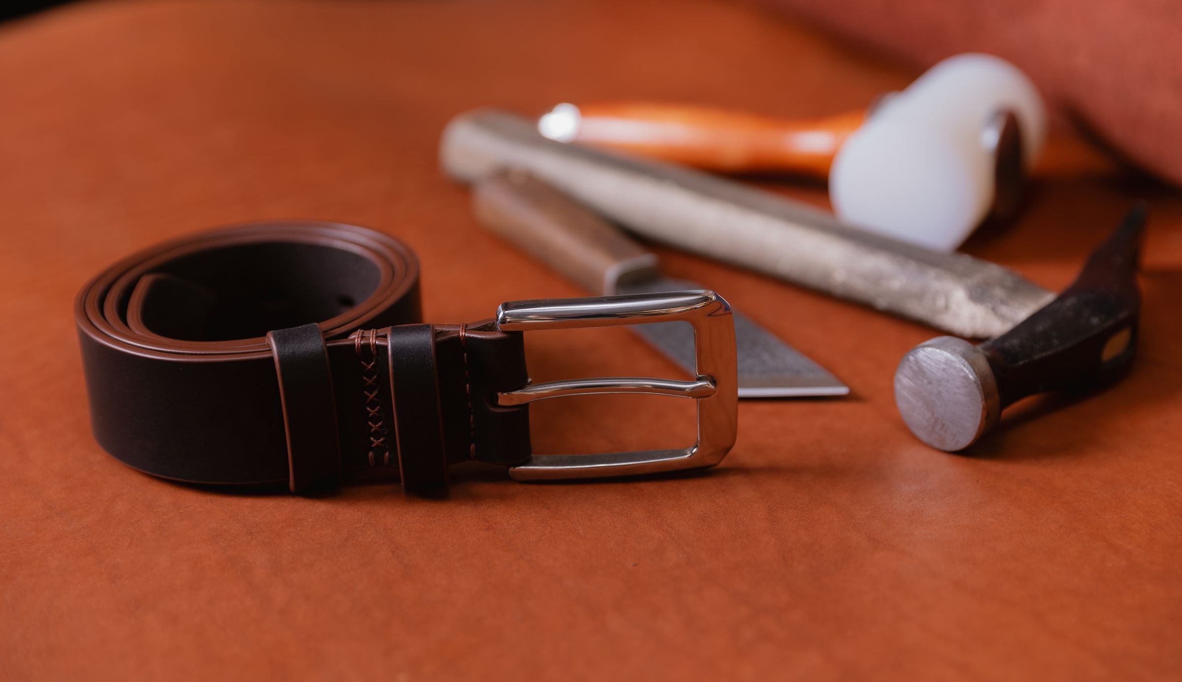 Leather belt with a range of shoe tools.