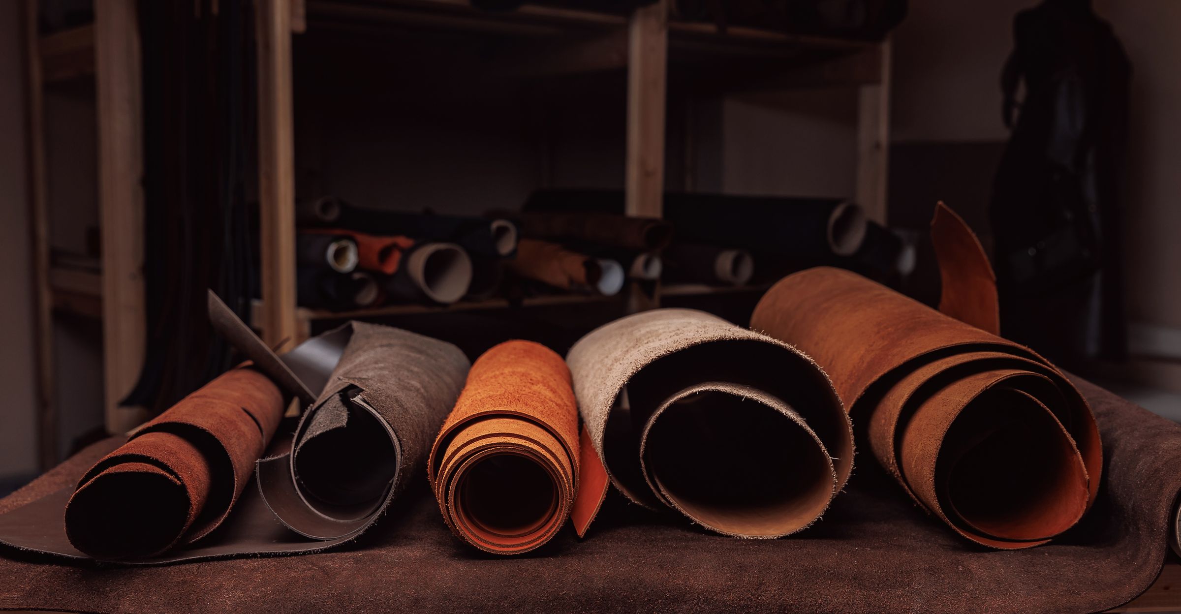 Range of different coloured suede hides in storage.