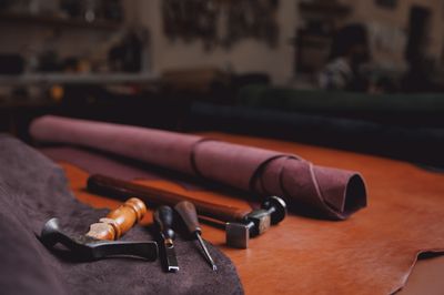 Shoe hammer with other shoemaking tools.