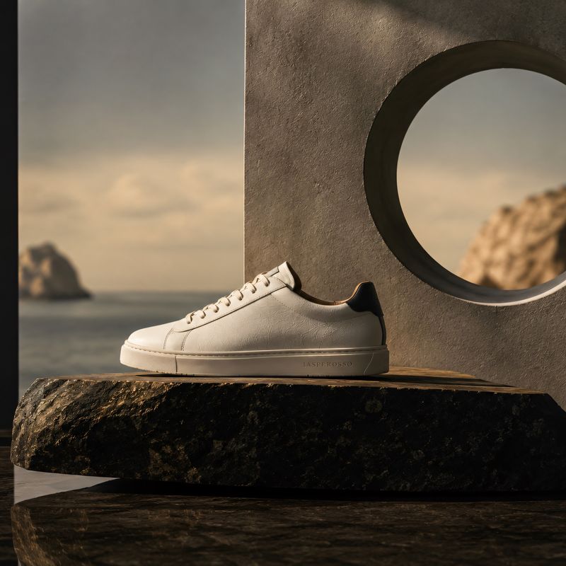 Jasperosso white pebble grained leather sneaker on display.